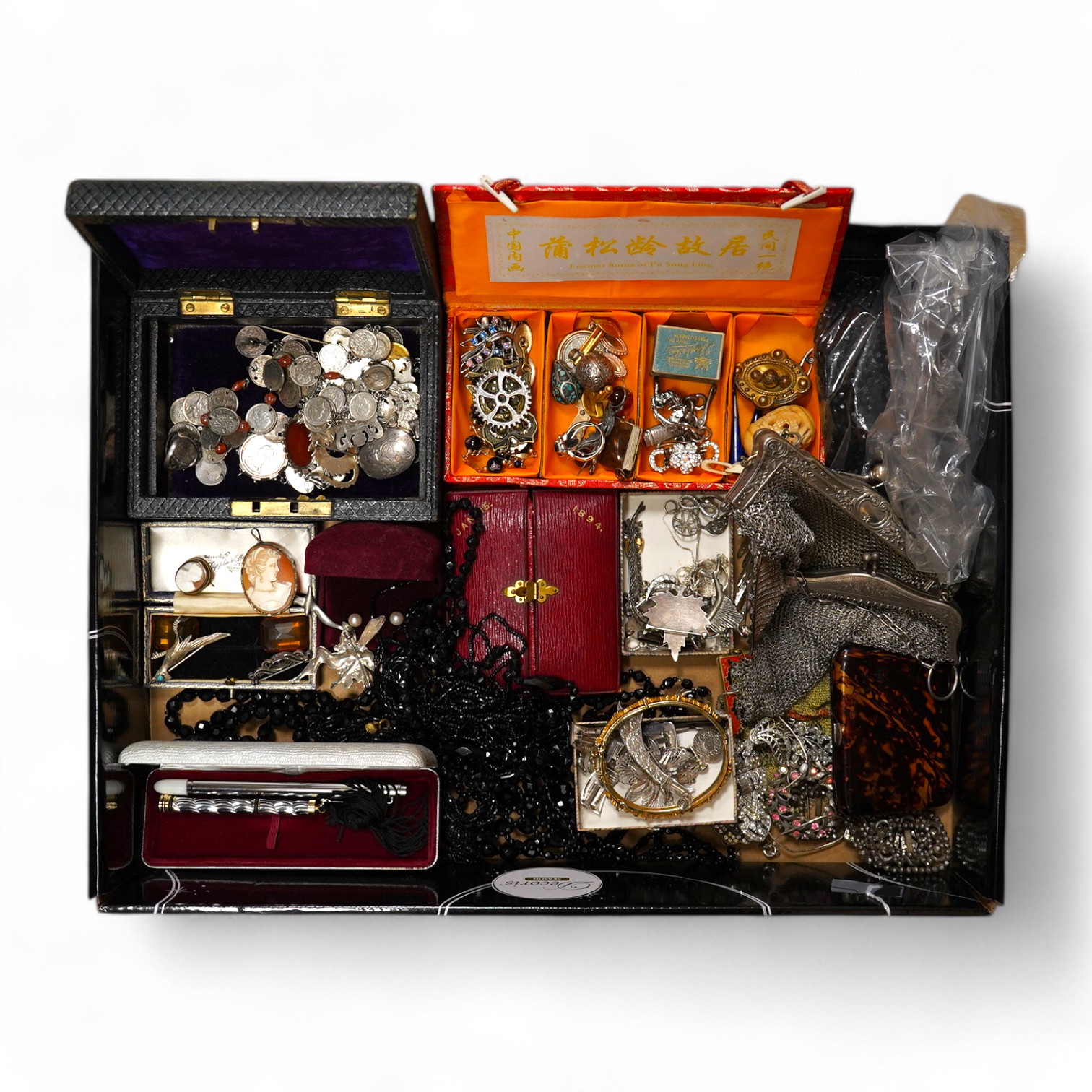 A quantity of assorted mainly costume jewellery including paste set brooches, necklaces, 925 items including pill box pendant, bracelet and coin set jewellery, a lacquer cigarette case and two evening purse, etc. Conditi